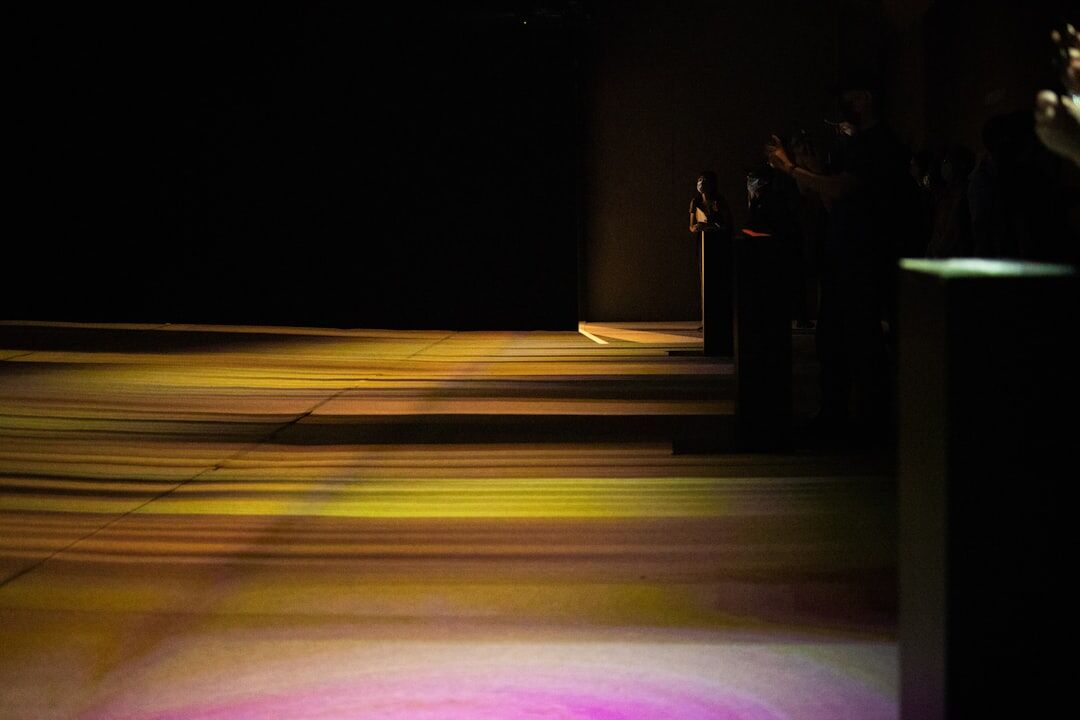 Fashion runway show with dramatic lighting