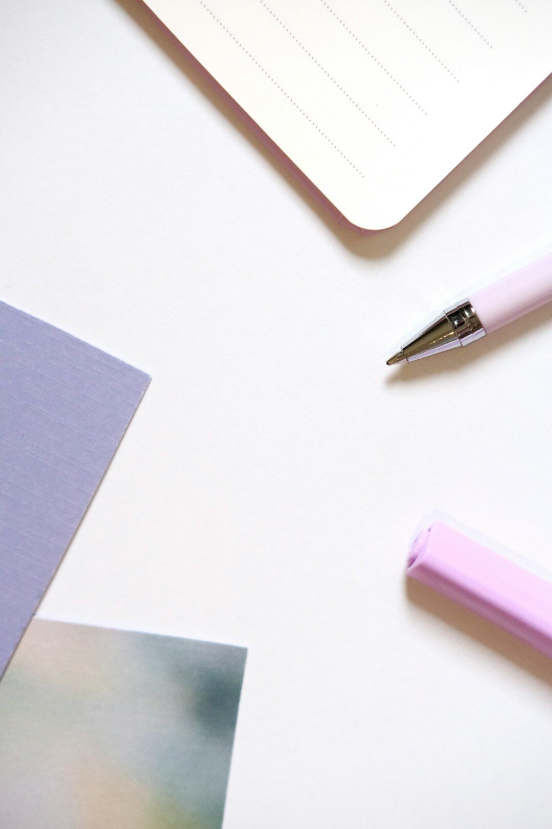 Fountain pen resting on stationery paper on a desk