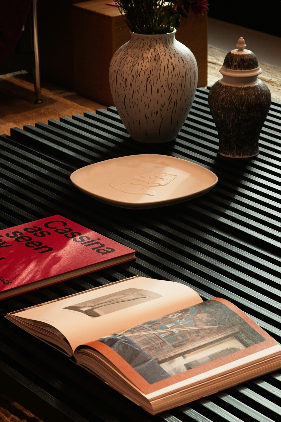 Stack of vintage glossy magazines arranged on a table